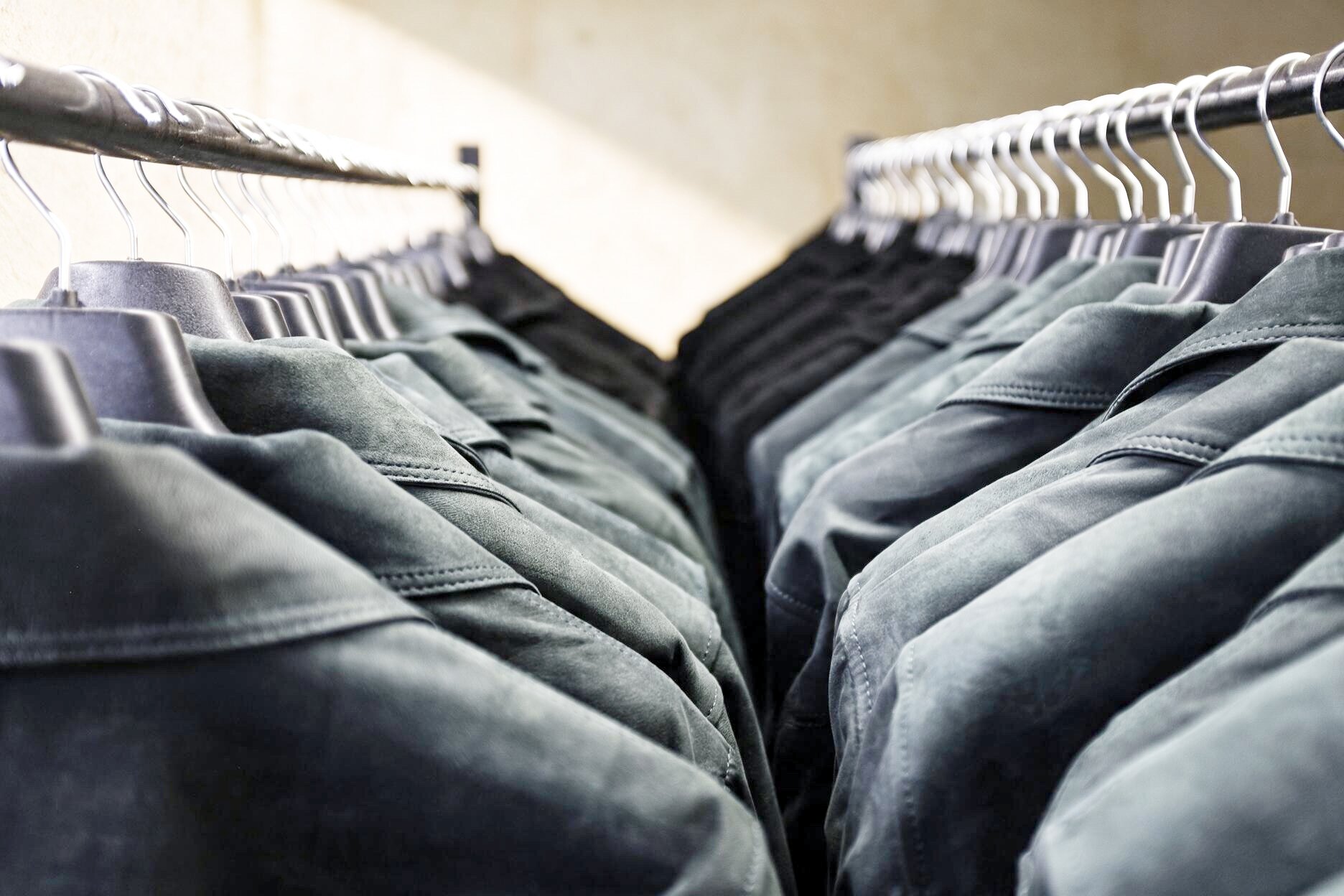 Identical suede jackets lined on the finishing rail