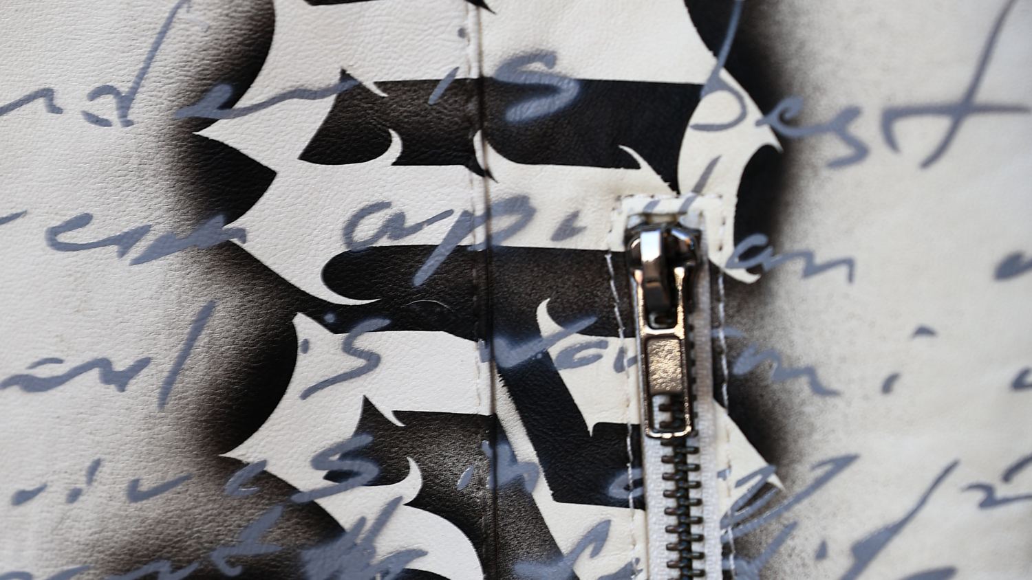 Hand-graffiti and script on leather