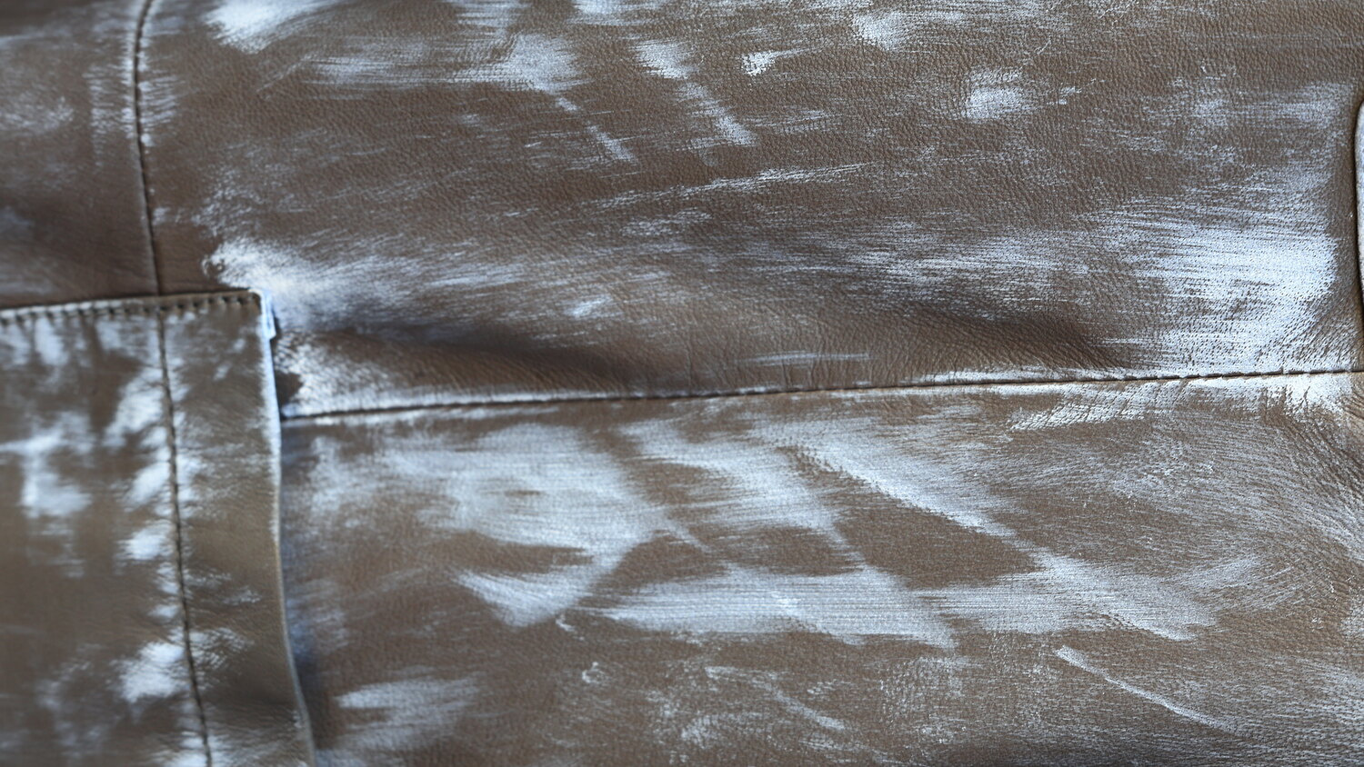 Hand-painted brushwork on a finished panel