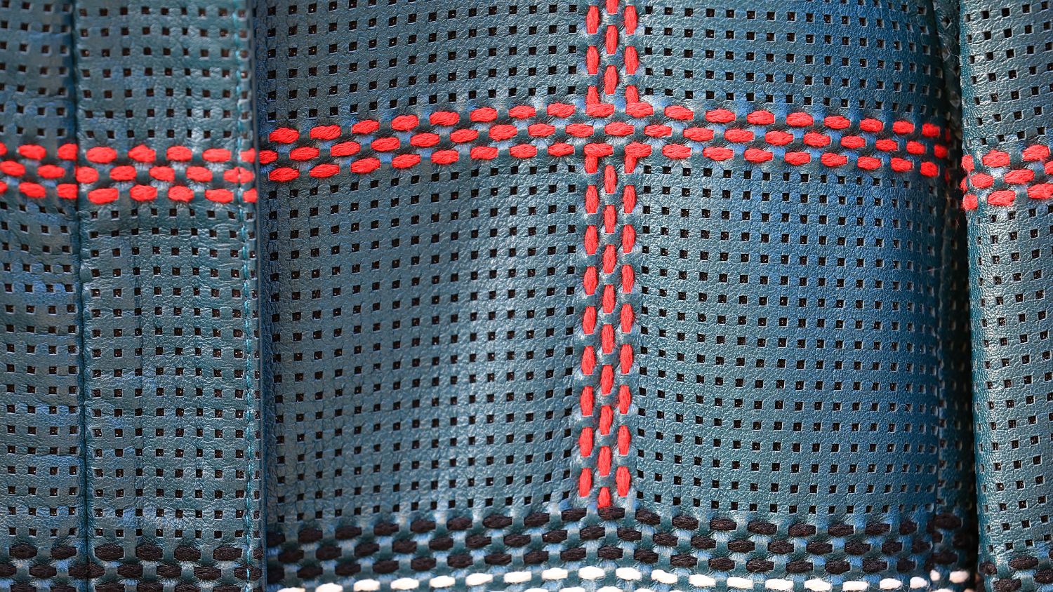 Custom perforation with red contrast stitching