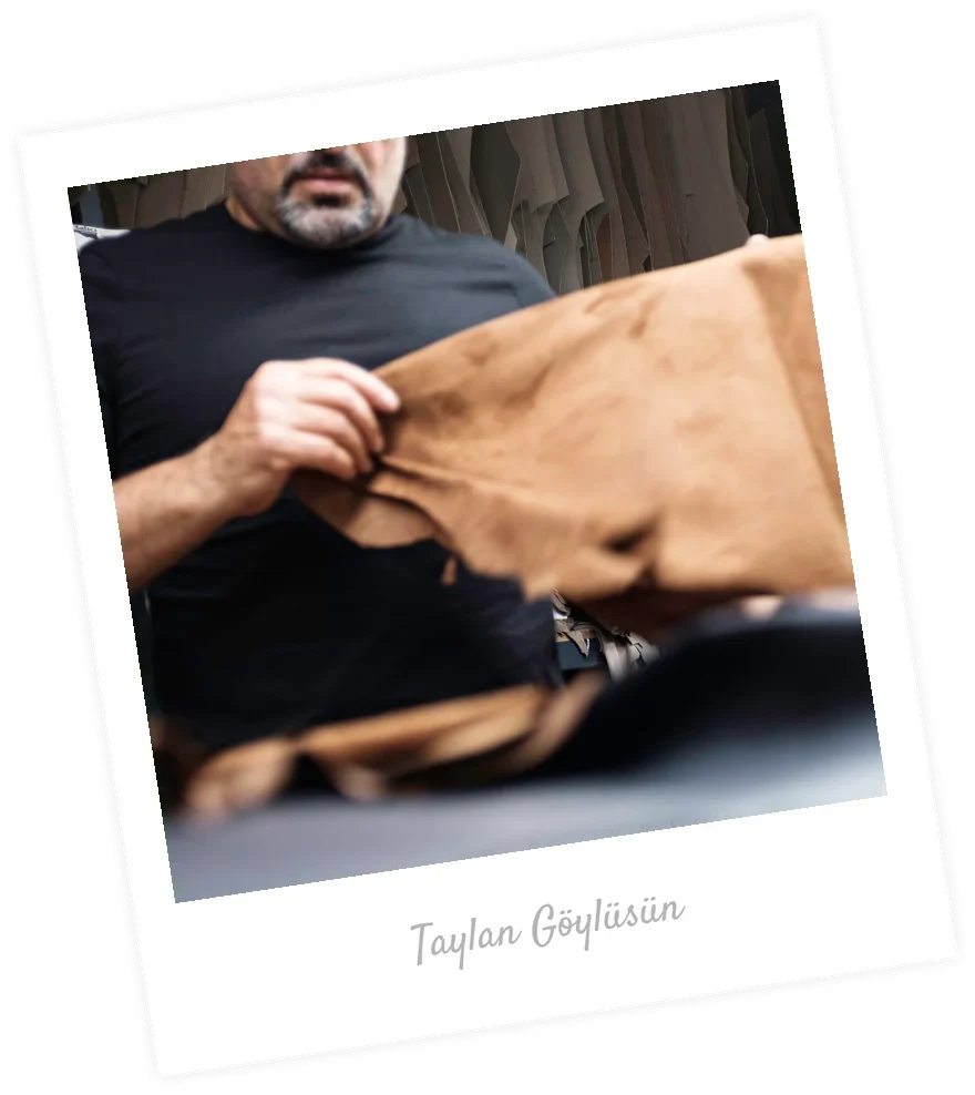 Taylan Göylüsün grading a skin at the cutting table